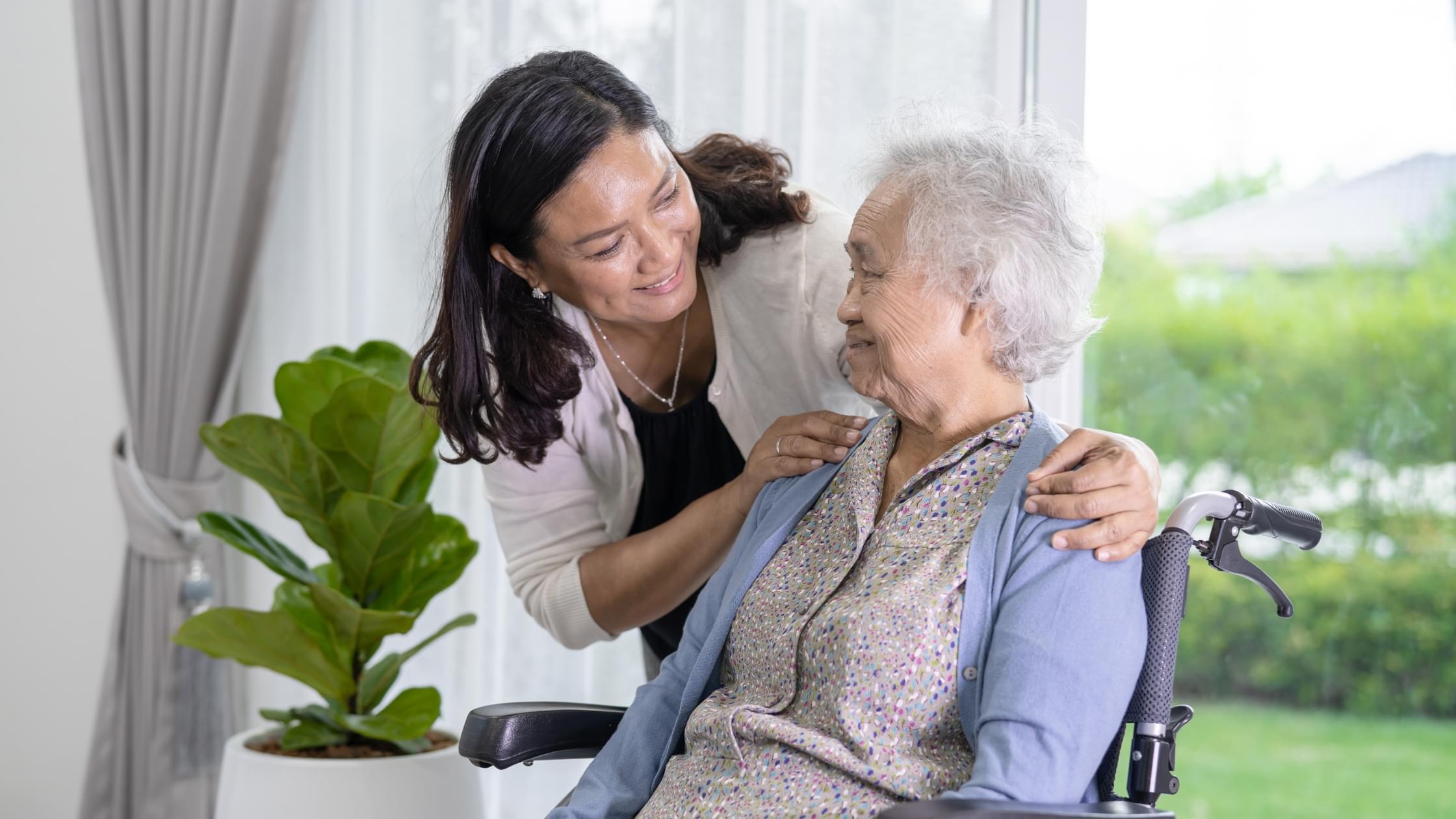 Family caregiver supporting an elderly loved one at home, demonstrating the important role of family caregivers in senior care.